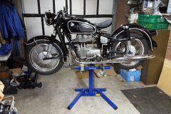 Classic BMW motorcycle on Big Blue lift